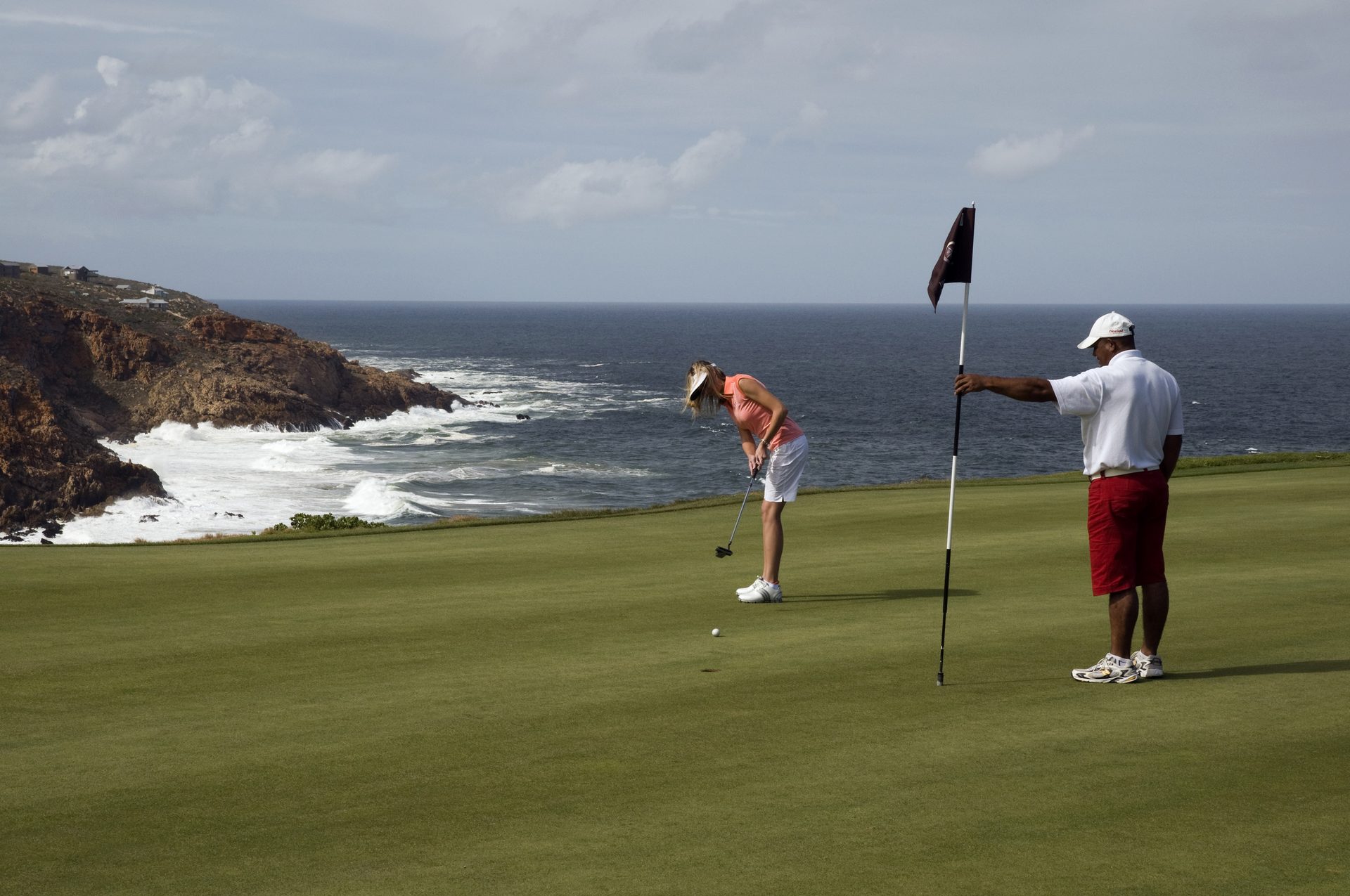 Aerial view of a Garden Route golf course with fairways and greens along the South African coast